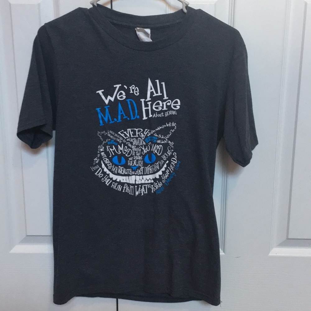 Dark grey t-shirt with Cheshire Cat design.